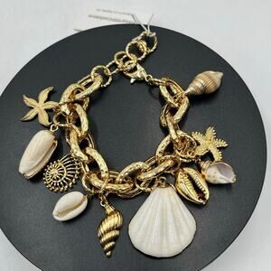 ETTIKA‎ Mermaid Tears
Sea Shell and 18k Gold Plated Charm Cha Cha Bracelet